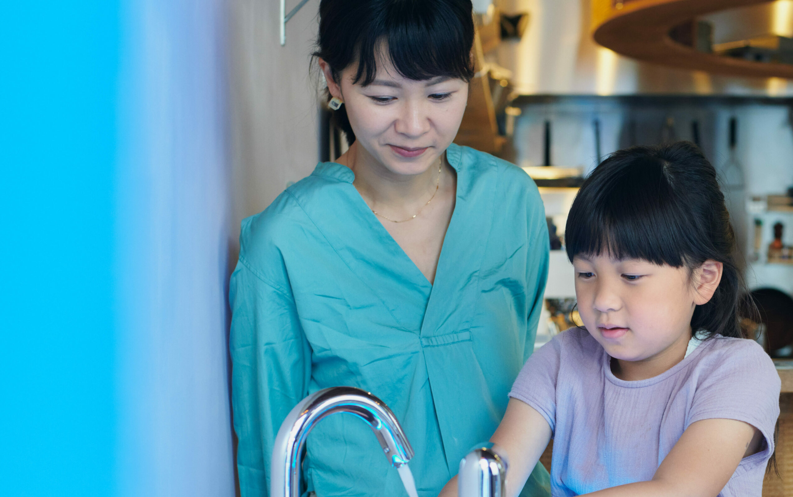 Parent and child washing hands