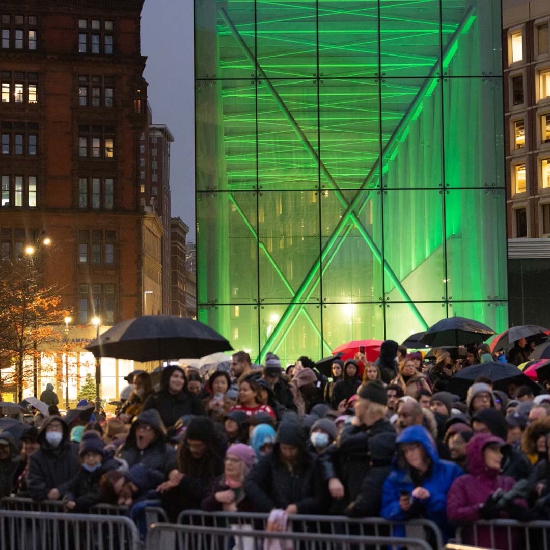 Crowds outside City Hall as it is lit up green in advance of The Earthshot Prize Awards