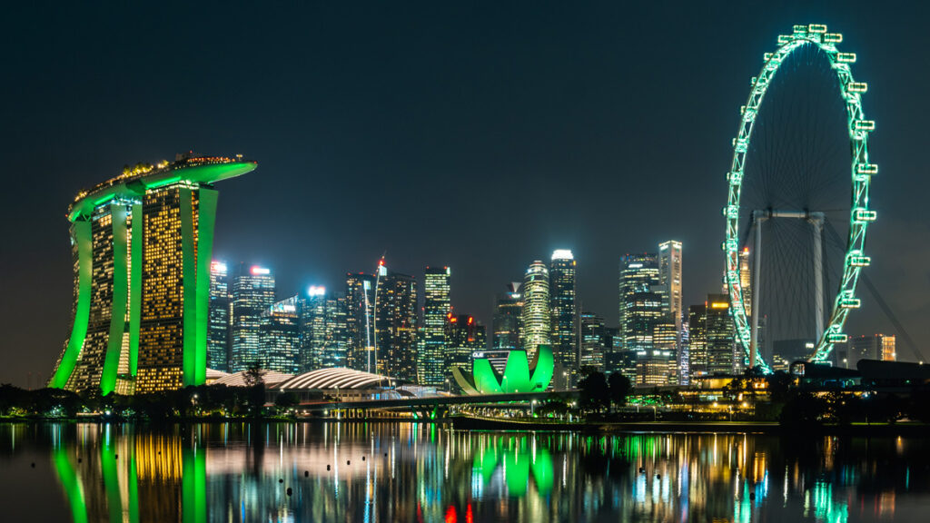 Marina Bay Sands, the ArtScience Museum and the Singapore Flyer all shine bright in green